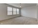 Bright bedroom featuring neutral carpeting and a large window for natural light at 12683 White Chapel Cir, Fishers, IN 46037