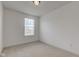 A carpeted bedroom featuring a window and white walls at 12683 White Chapel Cir, Fishers, IN 46037