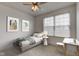 Styled bedroom with decor, neutral carpet, ceiling fan, and natural light from window at 12683 White Chapel Cir, Fishers, IN 46037