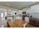 Eat-in kitchen with stainless steel appliances and dining table at 12683 White Chapel Cir, Fishers, IN 46037