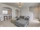 Comfortable living room with a gray sofa and a view of the kitchen at 12683 White Chapel Cir, Fishers, IN 46037