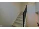 Carpeted staircase with dark trim and handrail leading to the upper level of the home at 12683 White Chapel Cir, Fishers, IN 46037