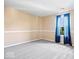 Neutral bedroom features plush carpet, fresh paint, and a window overlooking the front yard at 12741 Glengary Dr, Fishers, IN 46038