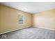 Spacious bedroom has plush carpet, a window, and ample natural light at 12741 Glengary Dr, Fishers, IN 46038