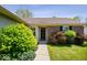 Inviting home entrance featuring brick accents, well-manicured bushes, and a paved walkway at 12741 Glengary Dr, Fishers, IN 46038