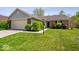 Charming single-story home with brick accents, attached garage, and a well-maintained front yard at 12741 Glengary Dr, Fishers, IN 46038