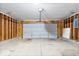 The garage features a functional overhead door with a sturdy concrete floor at 12741 Glengary Dr, Fishers, IN 46038