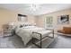 Cozy main bedroom with a comfortable king-sized bed, soft carpet, and tranquil natural light at 12741 Glengary Dr, Fishers, IN 46038