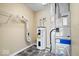 Utility room features modern water heater and HVAC system, ensuring efficient home climate control at 12741 Glengary Dr, Fishers, IN 46038