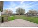 Backyard view from wooden deck with a fenced yard and a lush green lawn at 12949 Shandon Ln, Fishers, IN 46038