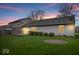 Back exterior view of the home and backyard featuring a deck and well-maintained lawn at 12949 Shandon Ln, Fishers, IN 46038