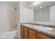 Well-lit bathroom featuring a double sink vanity, large mirror, and a shower-tub combination at 12949 Shandon Ln, Fishers, IN 46038