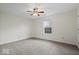 Bedroom with neutral carpet, ceiling fan, and a window letting in natural light at 12949 Shandon Ln, Fishers, IN 46038