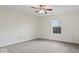 Bedroom featuring neutral carpet, ceiling fan, and a window letting in natural light at 12949 Shandon Ln, Fishers, IN 46038