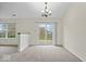Bright dining area with sliding glass doors leading to deck and view of the backyard at 12949 Shandon Ln, Fishers, IN 46038