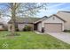Charming single story home with a well-manicured lawn and attached two car garage at 12949 Shandon Ln, Fishers, IN 46038