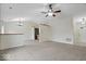 Open floor plan showcasing the spacious living area connecting to the kitchen, complete with modern appliances at 12949 Shandon Ln, Fishers, IN 46038
