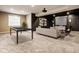 Finished basement featuring a pool table, comfortable seating area, and modern entertainment setup at 14910 Briarpatch Cir, Carmel, IN 46033
