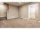 Spacious finished basement featuring neutral paint, carpet, and staircase leading up to the next level at 14910 Briarpatch Cir, Carmel, IN 46033