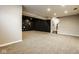 Expansive finished basement boasting neutral paint, recessed lighting, and a cozy staircase at 14910 Briarpatch Cir, Carmel, IN 46033