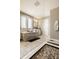 Bright bathroom featuring a walk-in shower, a tub, granite countertops, and neutral colors at 14910 Briarpatch Cir, Carmel, IN 46033