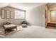 This attic bedroom has neutral-toned walls, carpet, decor, and natural lighting at 14910 Briarpatch Cir, Carmel, IN 46033