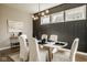 Inviting dining room with designer light fixture and sophisticated decor at 14910 Briarpatch Cir, Carmel, IN 46033