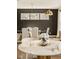 Elegant dining room with modern lighting and stylish wallpaper at 14910 Briarpatch Cir, Carmel, IN 46033