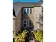 Inviting front entrance with decorative plants and brick accents enhances the home's charm at 14910 Briarpatch Cir, Carmel, IN 46033