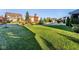 Lush front yard with healthy lawn featuring mature trees in a desirable neighborhood at 14910 Briarpatch Cir, Carmel, IN 46033