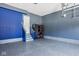 Well-organized garage with vibrant epoxy floors and walls, complete with shelving and storage at 14910 Briarpatch Cir, Carmel, IN 46033