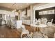 Well-lit kitchen with white cabinets, granite countertops, and a dining area at 14910 Briarpatch Cir, Carmel, IN 46033