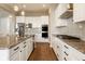 Spacious modern kitchen featuring an island with stainless steel appliances and a gas cooktop at 14910 Briarpatch Cir, Carmel, IN 46033