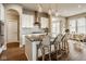 Bright kitchen featuring an island with seating and modern pendant lighting at 14910 Briarpatch Cir, Carmel, IN 46033