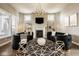 Sophisticated living room showcasing modern decor, a fireplace, and elegant lighting fixtures at 14910 Briarpatch Cir, Carmel, IN 46033