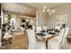 Open living area with modern decor and dining space featuring an archway and contemporary furniture at 14910 Briarpatch Cir, Carmel, IN 46033