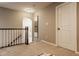This hallway loft has neutral-toned walls, plush seating, carpet, and decor at 14910 Briarpatch Cir, Carmel, IN 46033