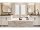 This primary bathroom features dual vanities, a soaking tub and lots of light at 14910 Briarpatch Cir, Carmel, IN 46033