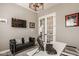 Cozy home office with contemporary design, leather sofa, and natural light at 14910 Briarpatch Cir, Carmel, IN 46033
