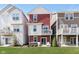 Well-maintained backyard with a grassy area, patio seating, and a colorful exterior view of the home at 15391 Mystic Rock Dr, Carmel, IN 46033