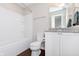 Well-lit bathroom with vanity, granite counters, toilet and shower-tub combo at 15391 Mystic Rock Dr, Carmel, IN 46033