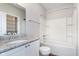 Bright bathroom featuring vanity with granite counter and combination shower-tub at 15391 Mystic Rock Dr, Carmel, IN 46033