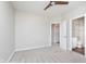 Bedroom featuring ceiling fan with attached bathroom and closet at 15391 Mystic Rock Dr, Carmel, IN 46033