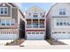 Charming three-story home with a two-car garage and dual balconies for outdoor living at 15391 Mystic Rock Dr, Carmel, IN 46033