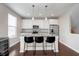 Modern kitchen island with granite countertops, stainless steel appliances, and pendant lighting at 15391 Mystic Rock Dr, Carmel, IN 46033