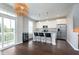 Kitchen area with a wine cooler, island, and stainless steel appliances overlooking a balcony at 15391 Mystic Rock Dr, Carmel, IN 46033