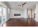 Spacious living room features a modern fireplace, wood floors, and sliding glass doors to the exterior at 15391 Mystic Rock Dr, Carmel, IN 46033
