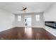 Open-concept living room with hardwood floors and a modern fireplace, creating a cozy atmosphere at 15391 Mystic Rock Dr, Carmel, IN 46033