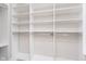 Spacious walk-in closet featuring custom shelving and ample storage space for clothing and accessories at 15391 Mystic Rock Dr, Carmel, IN 46033