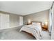 Comfortable bedroom features neutral paint, and a cozy bed with a soft blanket and pillows at 1557 N College Ave # 3, Indianapolis, IN 46202